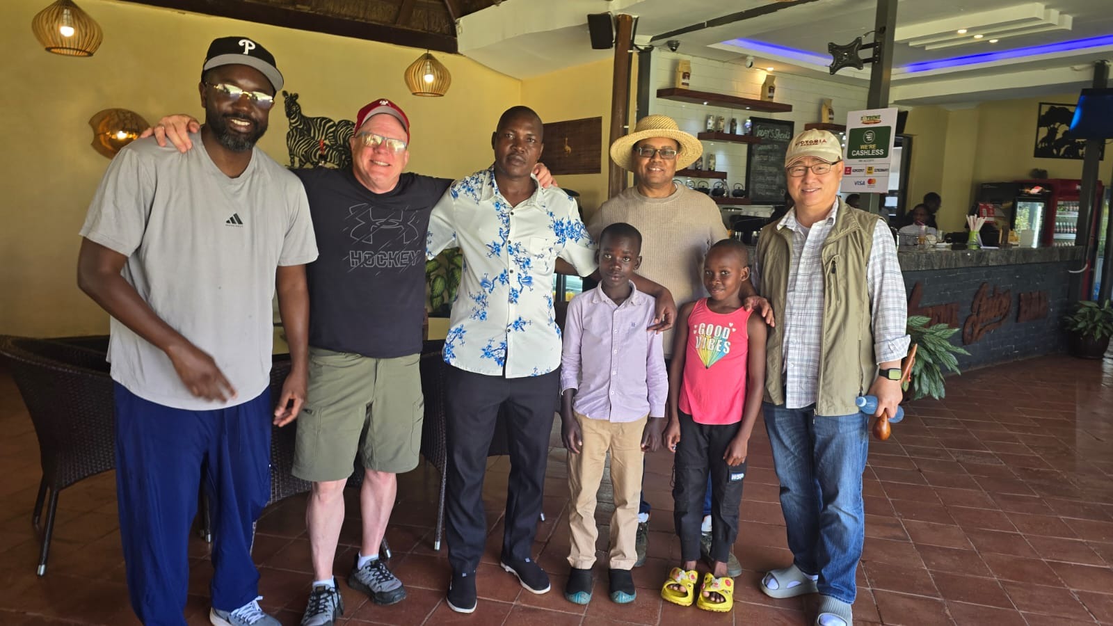 Mr. Yusuf with the Angel Heart and Soul Foundation team and two children